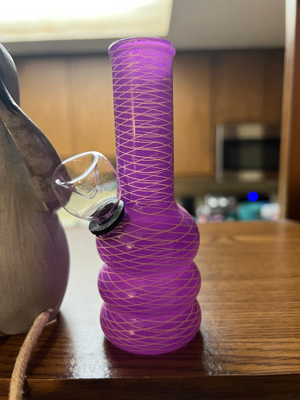 Ripkitty 5-inch soft glass water pipe, purple with gold crosshatch net texture, close-up of bowl joint and mid-section, bubble base visible