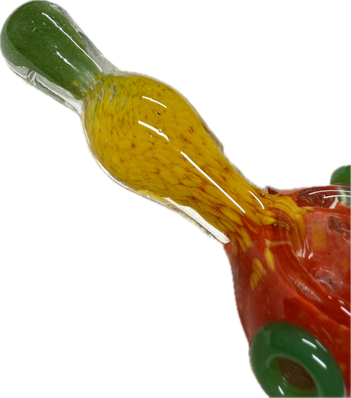 Macro close-up of Ripkitty rasta spoon pipe neck — yellow frit glass detail with green mouthpiece tip and red bowl base visible
