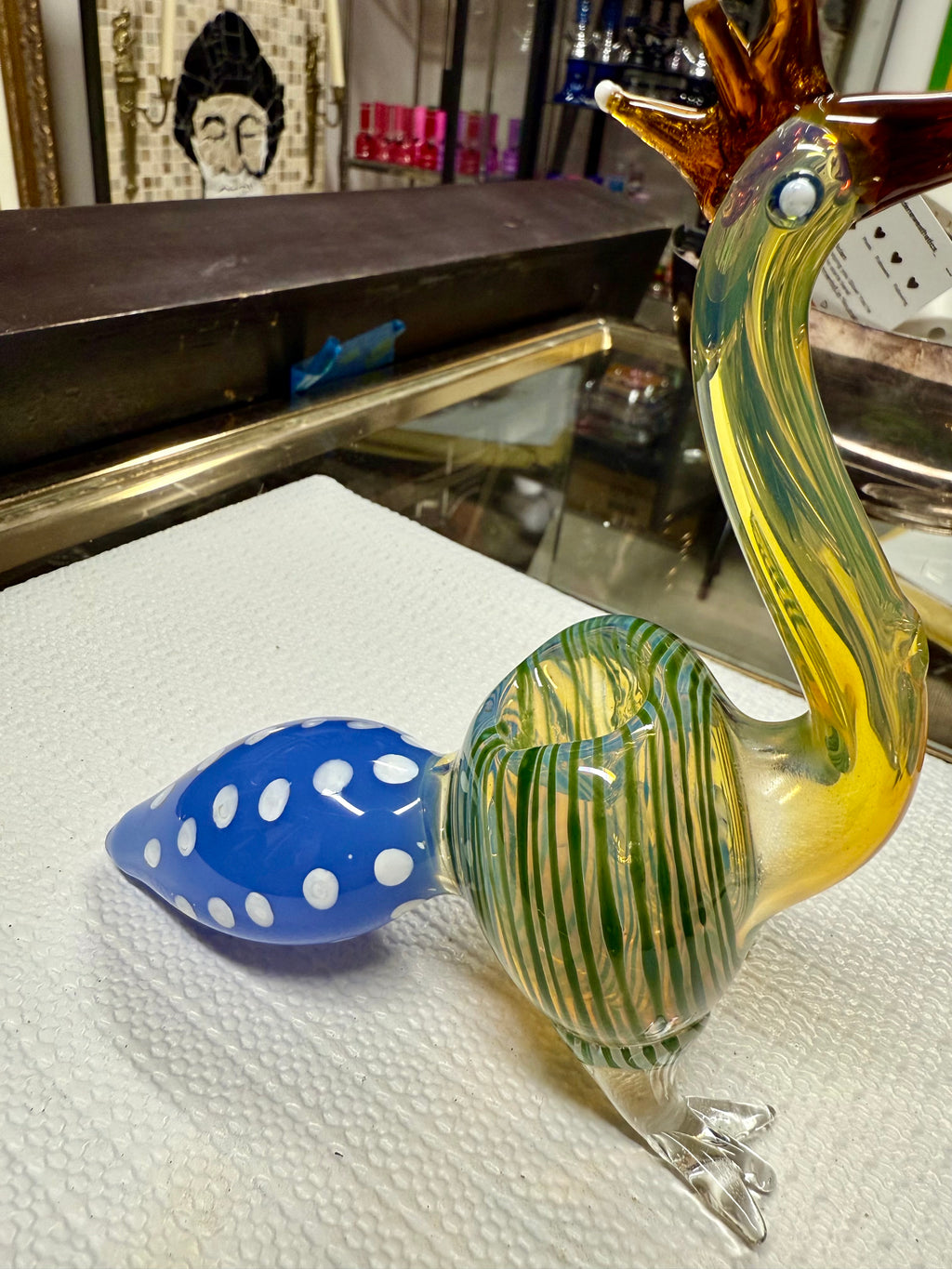 Ripkitty peacock glass pipe — close-up of blue polka-dot bowl with teal interior accent and yellow-amber body surround