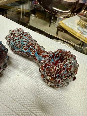 Ripkitty 5" blue spike spoon pipe — teal-blue and dark red frit pattern, close-up angled view of bowl end showing deep rounded chamber and full-body bubble nodule texture