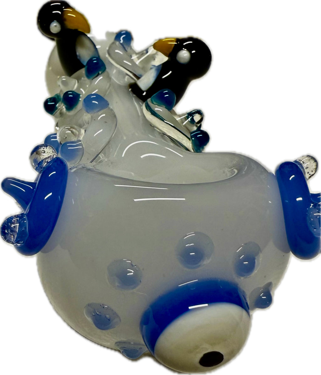 Ripkitty 4.5" penguin art pipe — frosted clear colorway, angled bowl-end view showing evil eye accent and dot pattern on translucent body